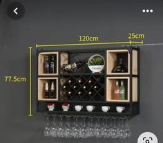 a wall mounted wine rack with bottles and glasses