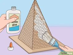 a hand holding a paintbrush next to a pyramid with the word white glue on it