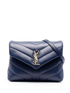 Saint Laurent crossbody bag in signature Y-quilted leather. Removable shoulder strap. Envelope flap with YSL logo; snap closure. Center slip pocket divides interior. One zip and one slip pocket. 5.1"H x 7.9"W x 2.8"D. Made in Italy. Ysl Toy Loulou, Ysl Toy, Logo Azul, Designer Crossbody Bags, Saint Laurent Bag, Purses Designer, Cute Bags, Branded Bags, Quilted Leather