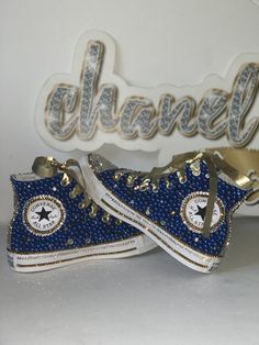 Custom Bling Converse All Star Chuck Taylor Sneakers. All designs handmade and embellished with a variety of high quality crystals. Great for weddings, proms, homecomings, birthdays, special events or just your everyday girly girl. **IF YOU NEED THIS ITEM BEFORE THE PROJECTED SHIPPING TIME YOU MUST CONTACT US BEFORE ORDERING (additional charges may apply) **Shoe Details:Blue high top Converse All Star Chuck Taylor Sneaker (Canvas Material)Shoe Size: Sizes stating at women's size 6 to women's siz Quince Shoes Sneakers Royal Blue, Quinceanera Sneakers Converse, Bedazzled High Top Converse, Converse Blinged Out, Navy Blue Bling Converse, Sparkle Converse, Bedazzled Converse, Rhinestone Converse, Studded Converse