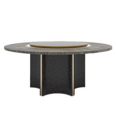 an oval dining table with black marble and gold accents