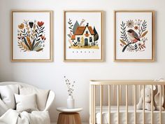 three framed pictures hang above a crib in a baby's room with a teddy bear