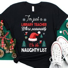 Library Teacher Christmas Shirt, Library Teacher Christmas Gift, Library Teacher Christmas Tshirt, Library Teacher Christmas Tee, Xmas Tee ❤️ This Library Teacher shirt is the perfect gift for Christmas!🎄 𝑾𝒉𝒚 𝒕𝒐 𝒄𝒉𝒐𝒐𝒔𝒆 𝒖𝒔? 👉𝐅𝐚𝐬𝐭 𝐬𝐡𝐢𝐩𝐩𝐩𝐢𝐧𝐠 👉𝐇𝐢𝐠𝐡 𝐪𝐮𝐚𝐥𝐢𝐭𝐲 𝐡𝐚𝐧𝐝𝐦𝐚𝐝𝐞 𝐩𝐫𝐨𝐝𝐮𝐜𝐭𝐬 👉𝐆𝐫𝐞𝐚𝐭 𝐜𝐮𝐬𝐭𝐨𝐦𝐞𝐫 𝐬𝐞𝐫𝐯𝐢𝐜𝐞 - 𝐲𝐨𝐮𝐫 𝐫𝐞𝐪𝐮𝐞𝐬𝐭/𝐪𝐮𝐞𝐬𝐭𝐢𝐨𝐧/𝐩𝐫𝐨𝐛𝐥𝐞𝐦 𝐢𝐬 𝐨𝐮𝐫 𝐩𝐫𝐢𝐨𝐫𝐢𝐭𝐲 👉𝐇𝐮𝐧𝐝𝐫𝐞𝐝𝐬 𝐨𝐟 𝐬𝐚𝐭𝐢𝐬𝐟𝐢𝐞? Graphic Fashion, Christmas Tshirt, Bella Canvas Tees, Gift For Christmas, Christmas Tees, Handmade Products, Zumba, Bodybuilder, Unisex Shirts