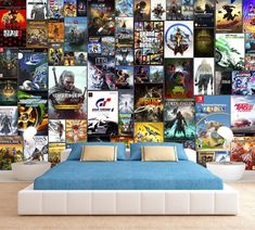 a bed sitting under a wall covered in lots of movie poster'd artwork on it