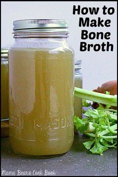 a mason jar filled with homemade bone broth next to some vegetables and other foods