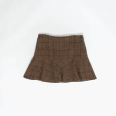 Woven Y2K plaid mini skirt by Ralph Lauren Rugby. This Y2K Ralph Lauren Rugby skirt features a brown, burgundy and blue plaid pattern, is fully lined, has a button closure on the left side and a buckle detail on the back. Made from a mid-weight wool and alpaca blend with a synthetic lining. Our recommended size: Medium to large Tag size: 6 Condition: Very good Material: 65% wool, 35% alpaca Lining: 100% cupro Measurements, laid flat, in inches:  Waist: 31 Hip: 38 Front length: 16 Back length: 16 Hem: 27 We recommend that you compare our measurements to a similar item of your own to ensure good fit. Measurements are taken flat and doubled for waist and hip. Our items are vintage and may show signs of previous wear, etc. Any significant wear, damage or obvious marks will be photographed. Ple Library Small Room, Dining Table Window, Kitchen With Dining Table, Pantry Dining Room, Tiny Nursery, Cloak Room, Bathroom Downstairs, Plaid Skort, Conservatory Garden