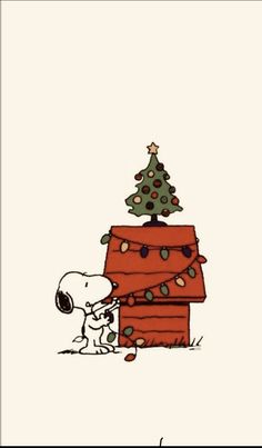 a charlie brown christmas card with a tree on top and a dog sitting in front of it