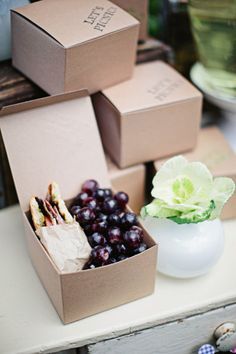 three boxes are stacked on top of each other with grapes in them and one is open