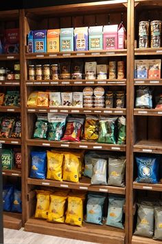 the shelves are filled with various types of food and snacks on display for customers to purchase