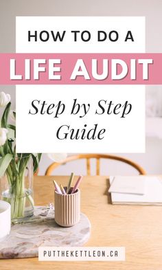 a wooden table with flowers and pencils on it in front of a sign that says how to do a life audit step by step guide