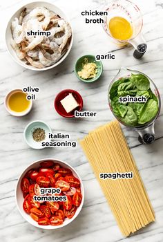 ingredients to make an italian pasta dish laid out on a marble table