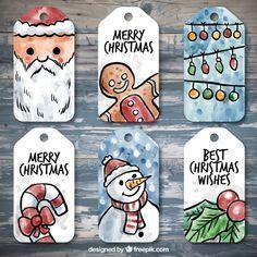 four christmas tags with santa claus, snowman and gingerbreads on them in watercolor