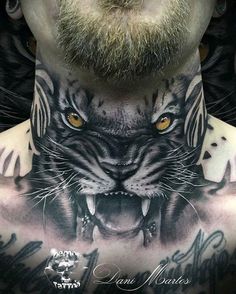 a man with a tiger tattoo on his chest