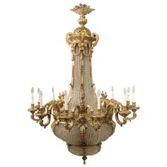 an antique chandelier with many lights on it's sides and gold trimmings