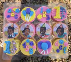 the cupcakes are decorated with princess and the frog characters on them, along with numbers