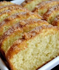 several pieces of cake sitting in a white dish