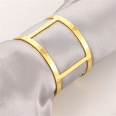 a napkin with a gold ring on it