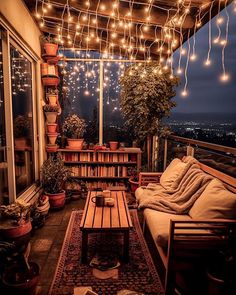 a living room filled with furniture and lots of lights hanging from the ceiling above it