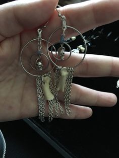 Earrings have skull bead inside hoop within a hoop, from which a coyote bone and silver chain is hanging. Approx 3 inches long Chain Earing, Cats Eye Gem, Oddities Jewelry, Goth Core, Eye Gems, Bone Crafts, Bone Earrings, Shark Tooth Necklace, Tooth Necklace