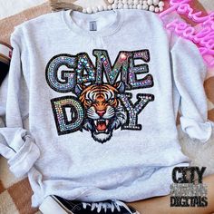 a sweatshirt with the words game day on it and a tiger's head in sequins