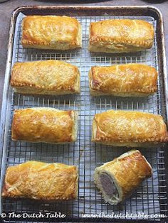 several pastries on a baking rack ready to be baked