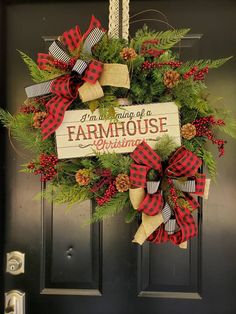 a christmas wreath hanging on a door with the words i'm going to be a farmhouse