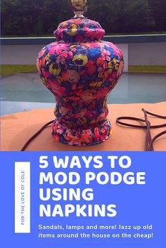 a colorful vase sitting on top of a table next to a blue sign that says 5 ways to mod podge using napkins