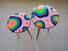 two colorful cake pops sitting on top of each other