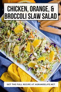 chicken, orange and broccoli slaw salad on a white platter