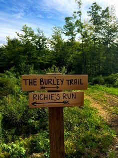 the burley trail sign is pointing in opposite directions