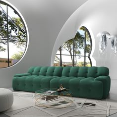 a living room with green couches and round windows