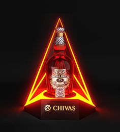 a bottle of chivas is lit up in the shape of a triangle with a diamond on top