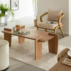 a wooden table sitting on top of a white rug