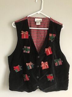 a black vest with christmas presents on it