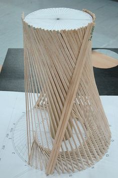 a wooden sculpture sitting on top of a table