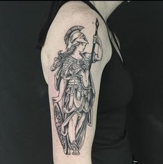 a woman with a tattoo on her arm