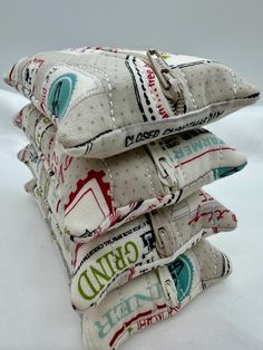 four pillows are stacked on top of each other