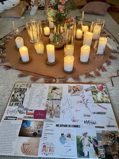 a table topped with lots of candles and pictures