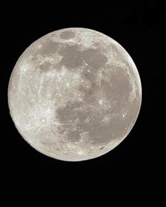 the full moon is seen in the sky with no clouds on it's side