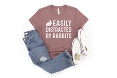 PLEASE READ BEFORE BUYING A UNISEX SHIRT YOU WILL LOVE: This funny rabbit shirt is the perfect tee for any bunny lover.  This shirt also makes a great gift as it is both personal and functional. It is something the person can frequently use and can be gifted for a variety of occasions.  Make sure to grab it early to get it in time. Each t-shirt is made to order and ships from the USA.  T-SHIRT DETAILS Our premium unisex t-shirts are super SOFT, COMFY, and LIGHT with just the right amount of stretch. We are sure you'll LOVE how these shirts feel. The unisex size fits well for most women but it's best to view the size chart image for exact t-shirt measurements.  Men typically order their normal size. However, men that like their shirts a little more loose fitting should order one size up.  * Education Shirts, Funny Rabbit, New Teacher Gifts, Rabbit Gifts, Rabbit Lover, Bunny Shirt, Unisex Shirt, Really Cool Stuff