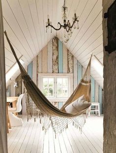 a hammock hanging in the middle of a room