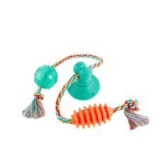 an orange and green toy with tassels on it's end, attached to a cord