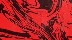 a red and black background with swirls on it