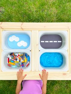 an overhead view of a child's play tray on the grass