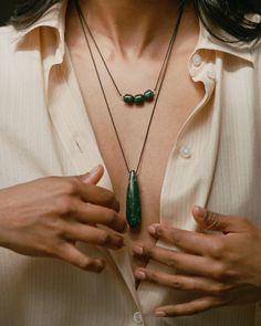 MONIKH DALE x DAPHINE A striking Jade stone teardrop-shaped pendant is at the heart of the Dhari Necklace. Meticulously polished to reveal its unique natural lines and rich green hues, each pendant is one-of-a-kind, ensuring that no two stones are alike. The stone hangs from a long rope which can be adjusted to your desired length. We love it stacked with the Dale Necklace for the perfect summer look. Necklaces For Summer, Monikh Dale, Jewellery Styling, Cord Necklaces, Lucy Williams, Summer Jewellery, Red Tourmaline, Long Rope, Gold Plated Bangles