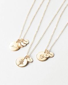 Tell a sparkling story with a symbolic disk paired with (up to five!) tiny initial tags — one for all your loves. Another reason to love this piece: you can add extra initial tags as your story grows! Dainty 14k Gold Filled Engraved Charm Necklaces, Everyday Jewelry With Round Flower Charm Pendant, Everyday Jewelry With Flower Charm Round Pendant, Delicate Necklace With Charms For Mom, Charming Gold Flower Pendant Jewelry, Delicate Round Pendant Charm Necklace For Mom, Everyday Jewelry With Flower Charm Pendant, Everyday Jewelry Pendant With Flower Charm, Everyday Flower Charm Pendant Jewelry