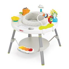 a baby's high chair with various toys on it