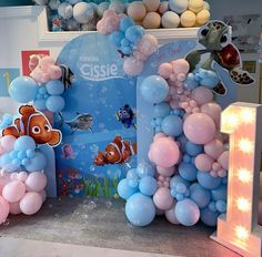 balloon decorations are displayed on the floor at a children's birthday party