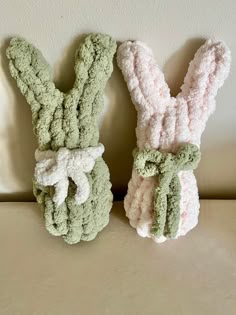 two crocheted bunny bunnies sitting next to each other