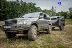 an off road vehicle parked in the grass